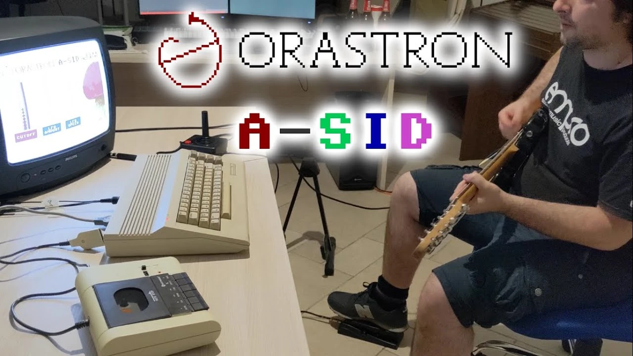 Demo video thumbnail - C64 running A-SID and Stefano playing guitar with a pedal