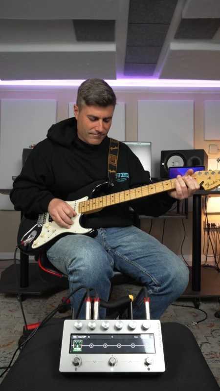 Demo video thumbnail - Vicenzo De Caro playing guitar in studio with a Darkglass Anagram in foreground